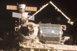 Canadarm2 is used to attach Columbus to the International Space Station. Image credit Logos In Space