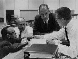 Deke Slayton gets into an intense discussion with some mission controllers.