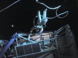 A Skylab crew member doing a handstand